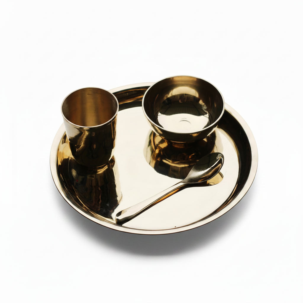 Glossy bronze Kansa baby dinner set with plate, bowl, spoon and glass on white background
