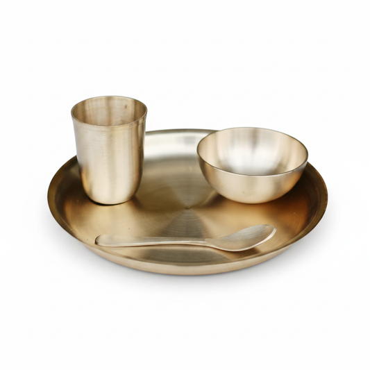 Matte bronze Kansa baby dinner set with plate, bowl, spoon and glass on white background
